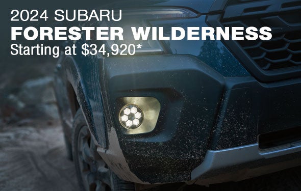 2024 Subaru Forester Wilderness Starting at $34,920 | Close-up of the right headlight illuminated at night featuring the 2024 Forester Wilderness