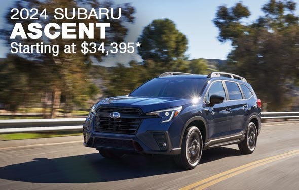 2024 Subaru Ascent Starting at $34,395 | A blue 2024 Ascent driving down a road